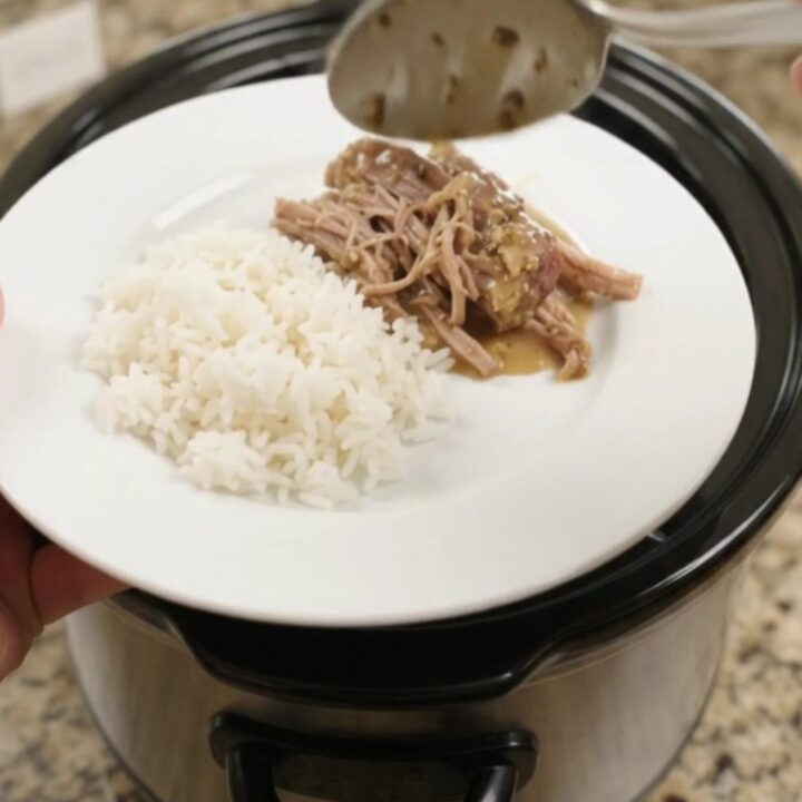 Shredded pork sirloin roast in a creamy Dijon sauce in a slow cooker