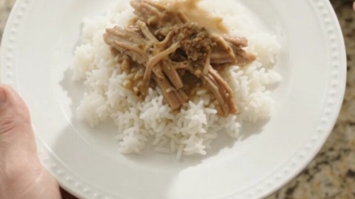 Slow cooker pork sirloin roast with potatoes and carrots in creamy Dijon gravy