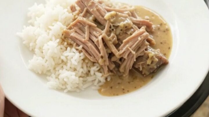 Shredded pork sirloin roast with portobello mushrooms in creamy Dijon sauce in a slow cooker
