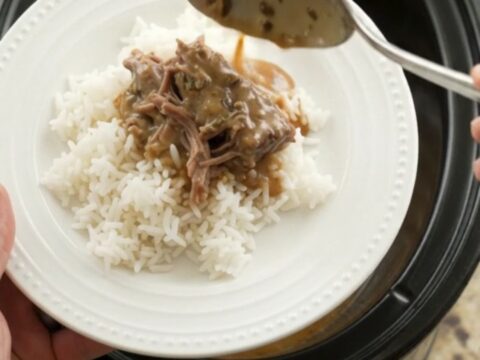 Fork-tender shredded beef in creamy gravy in a slow cooker