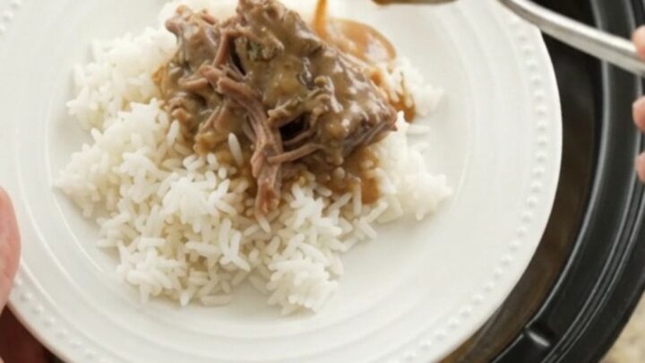 Fork-tender shredded beef in creamy gravy in a slow cooker