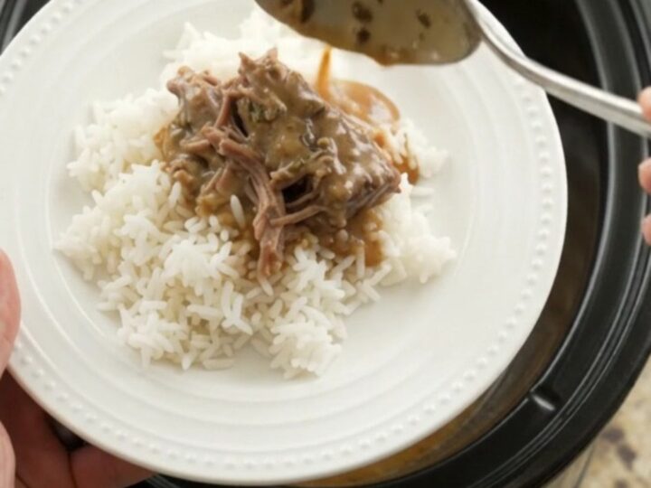 Fork-tender shredded beef in creamy gravy in a slow cooker