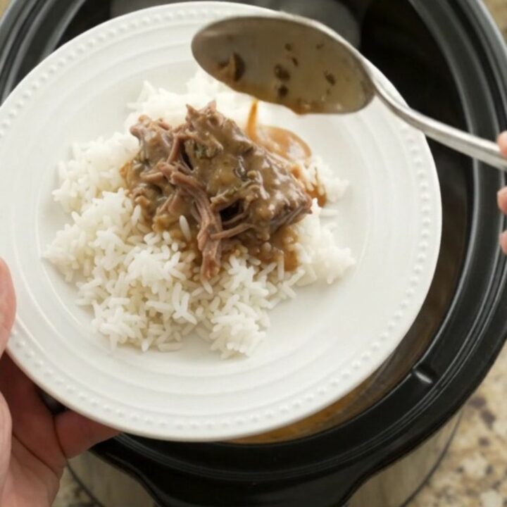 Fork-tender shredded beef in creamy gravy in a slow cooker