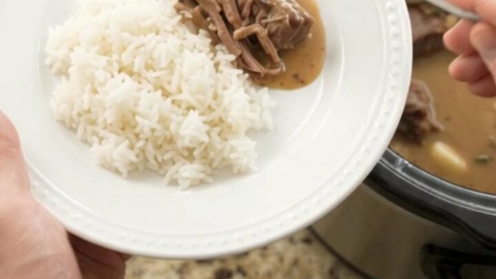 Fork-tender beef roast in creamy Dijon sauce with garlic and herbs in a slow cooker