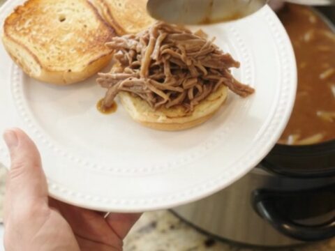 Slow cooker French onion brown gravy bottom round roast with caramelized onions and rich gravy