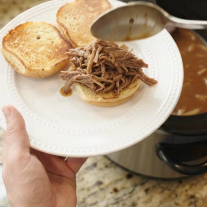 Slow cooker French onion brown gravy bottom round roast with caramelized onions and rich gravy