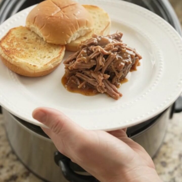 Slow-cooker beef pot roast with potatoes and carrots in rich brown gravy