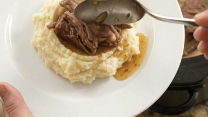 Fork-tender beef roast with portobello mushrooms in a buttery jus in a slow cooker