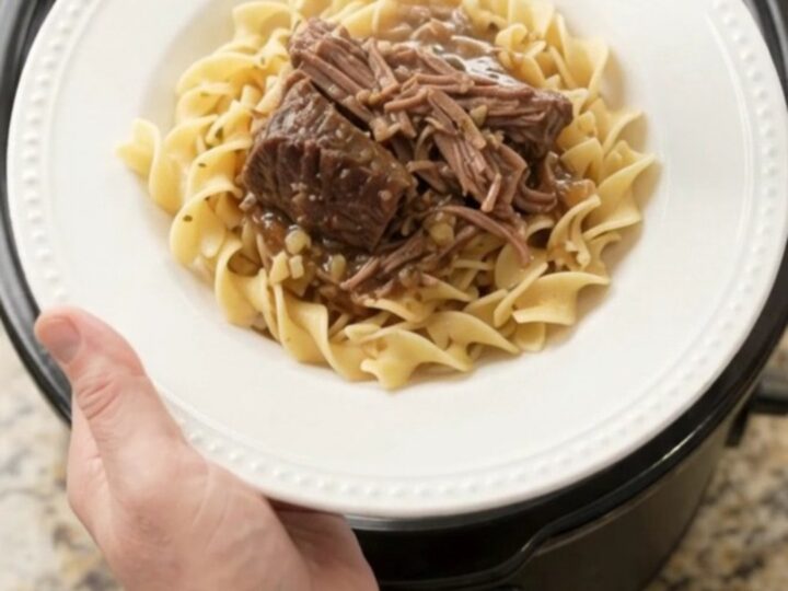 Slow cooker bottom round roast with peppers and butter, ready to serve