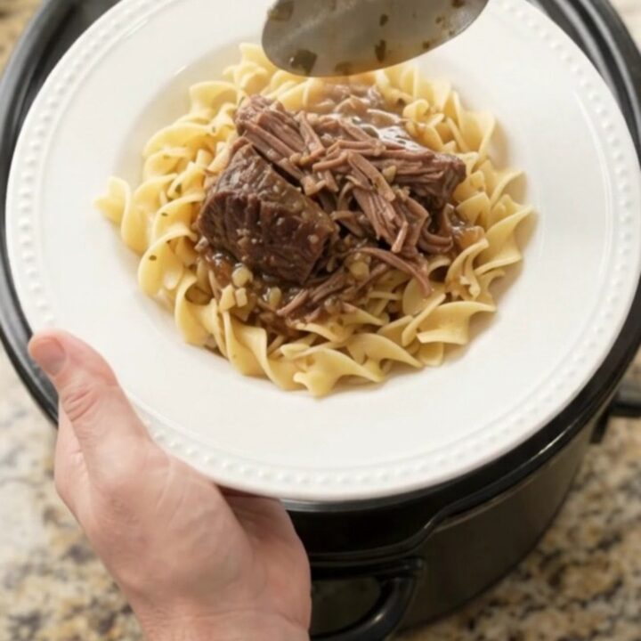 Slow cooker bottom round roast with peppers and butter, ready to serve