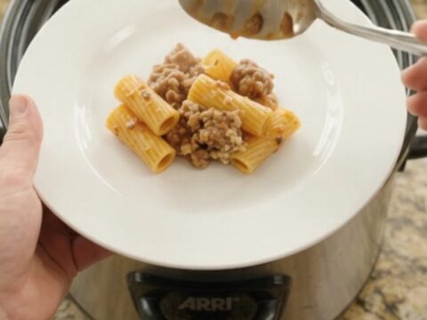 Bubbling crockpot rigatoni with sausage, ricotta, and melted provolone