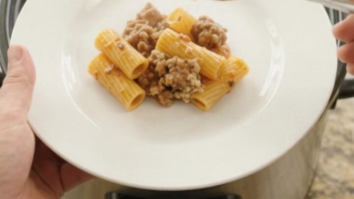 Bubbling crockpot rigatoni with sausage, ricotta, and melted provolone