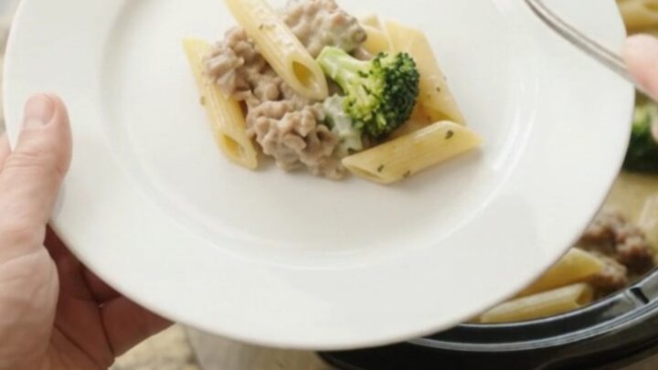 Creamy Boursin sausage Alfredo penne in a slow cooker with melted cheese