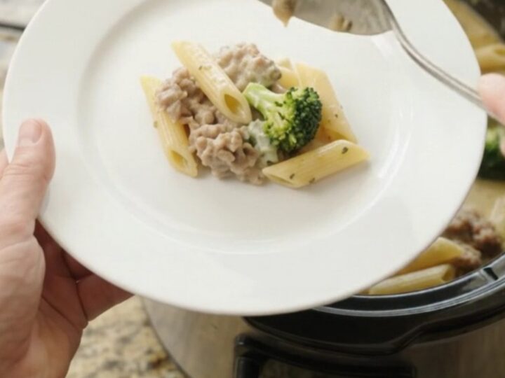 Creamy Boursin sausage Alfredo penne in a slow cooker with melted cheese