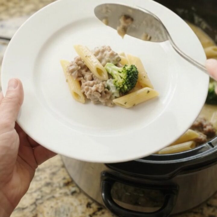 Creamy Boursin sausage Alfredo penne in a slow cooker with melted cheese