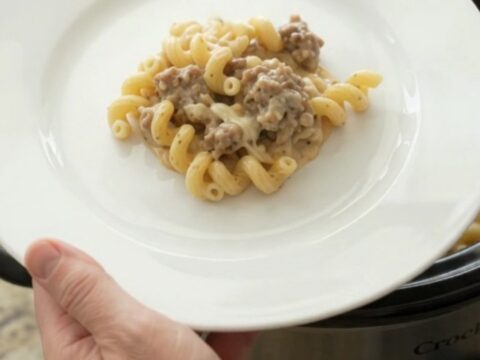 Creamy cavatappi pasta with sausage and melted mozzarella in a slow cooker