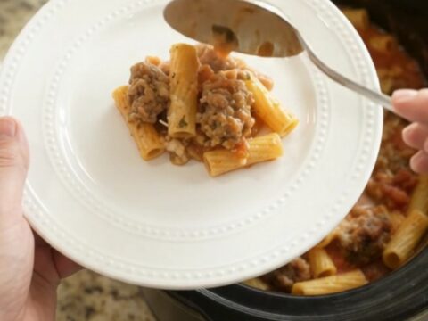 Slow cooker Parmesan sausage baked ziti with bubbling cheese and golden crust