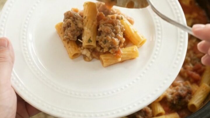Slow cooker Parmesan sausage baked ziti with bubbling cheese and golden crust