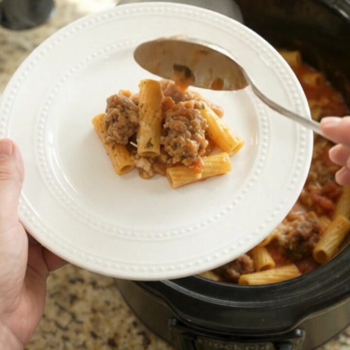 Slow cooker Parmesan sausage baked ziti with bubbling cheese and golden crust