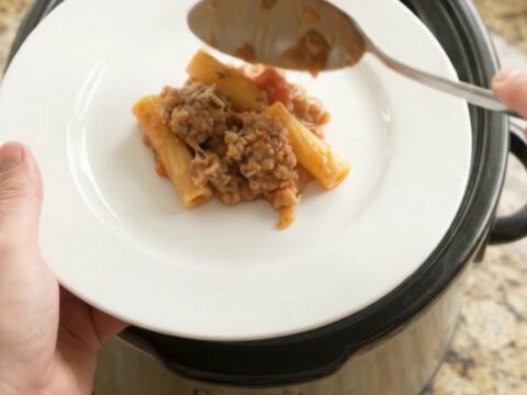 Crockpot Boursin sausage baked ziti with melted cheese and herbs