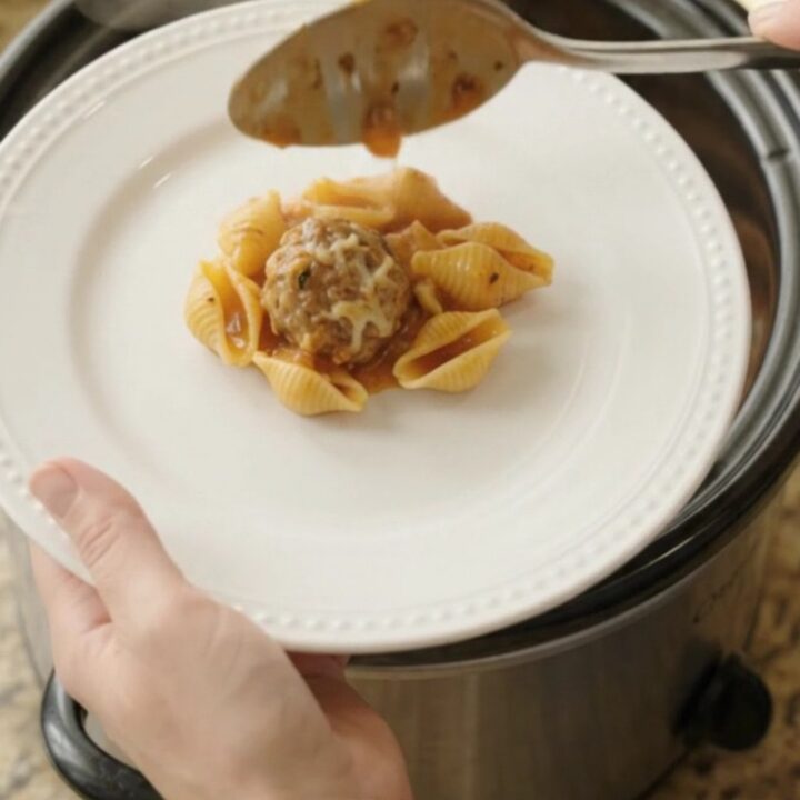 Crockpot Parmesan Meatball Red Pepper Shells with melted cheese and pasta