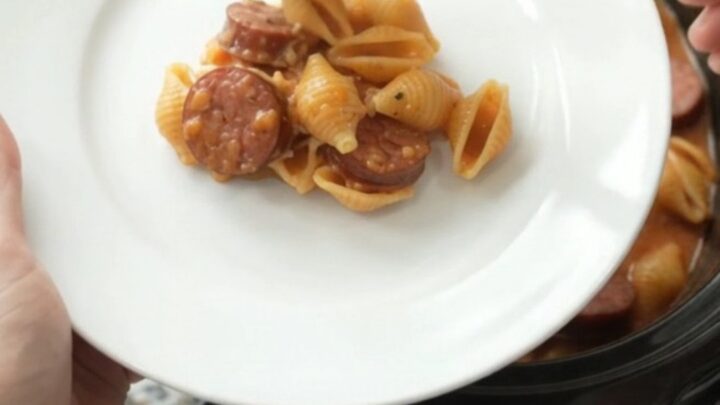 Slow cooker kielbasa pasta with creamy red pepper sauce and melted mozzarella