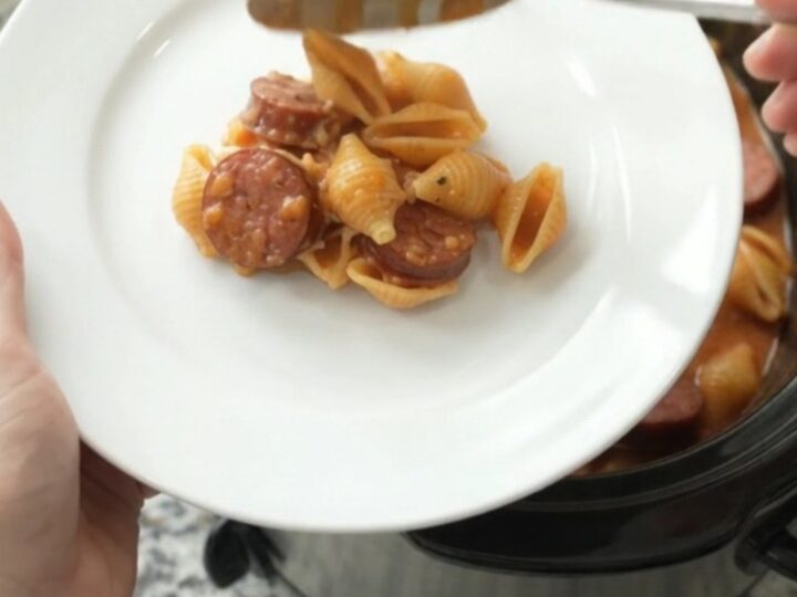 Slow cooker kielbasa pasta with creamy red pepper sauce and melted mozzarella