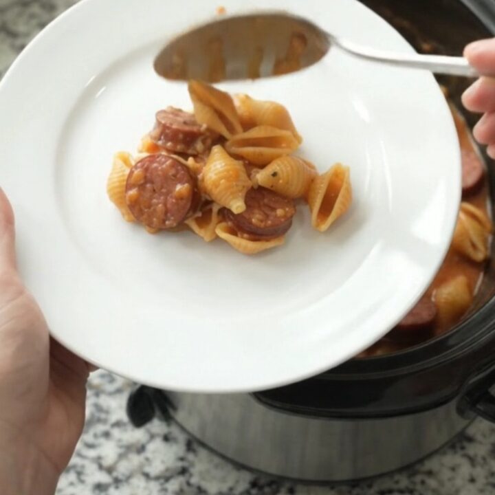 Slow cooker kielbasa pasta with creamy red pepper sauce and melted mozzarella