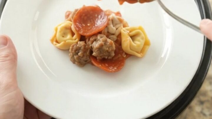 Bubbling Crockpot pepperoni sausage tortellini with melted mozzarella