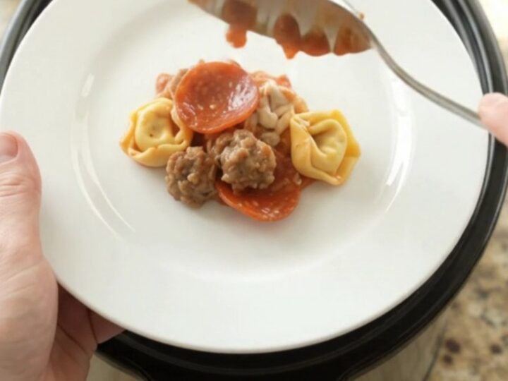 Bubbling Crockpot pepperoni sausage tortellini with melted mozzarella