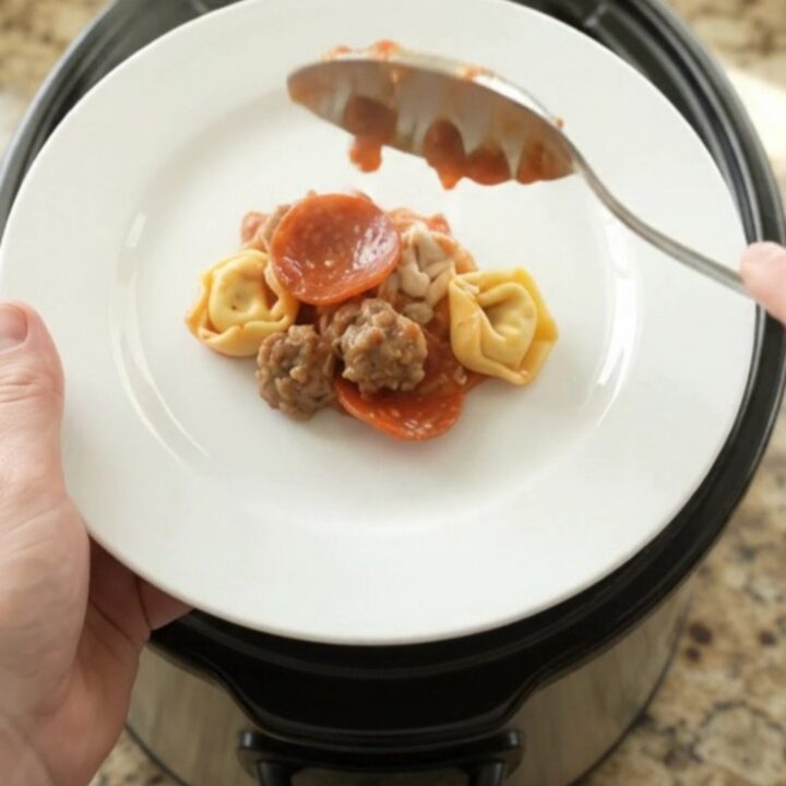 Bubbling Crockpot pepperoni sausage tortellini with melted mozzarella