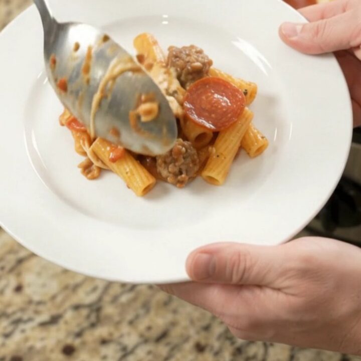 Slow cooker bubbling with cheesy pepperoni sausage ziti