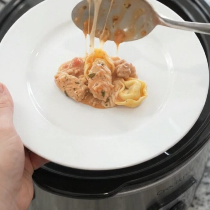 Crockpot Boursin Chicken Marinara Tortellini in a slow cooker, creamy sauce with chicken and tortellini