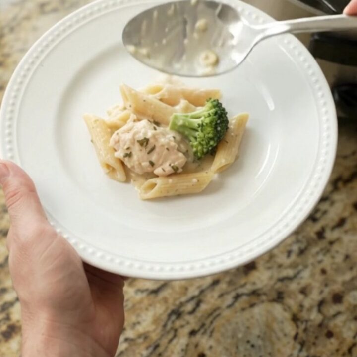Creamy Crockpot Boursin chicken Alfredo penne with broccoli and melted fontina in a slow cooker