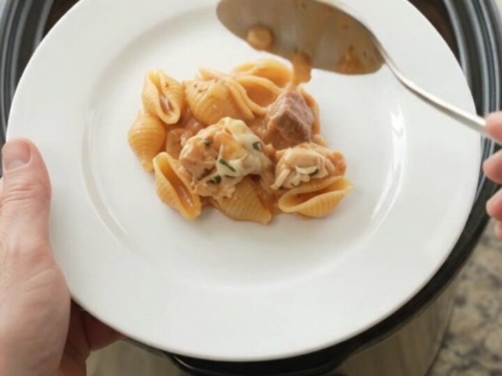 Creamy slow cooker chicken pasta with red pepper sauce and melted cheese