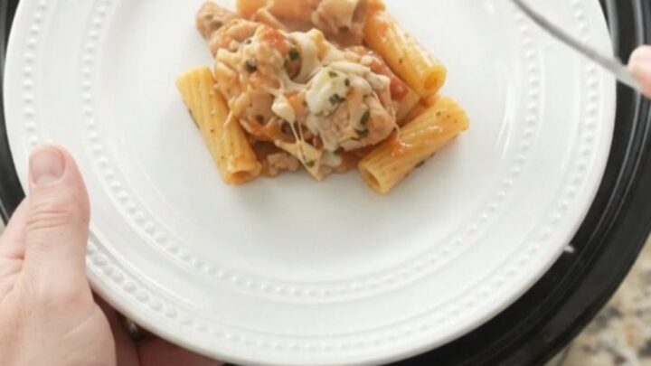 Bubbling slow cooker chicken baked ziti with melted mozzarella and creamy sauce