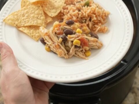 Crockpot full of creamy pepper jack chicken with black beans and corn