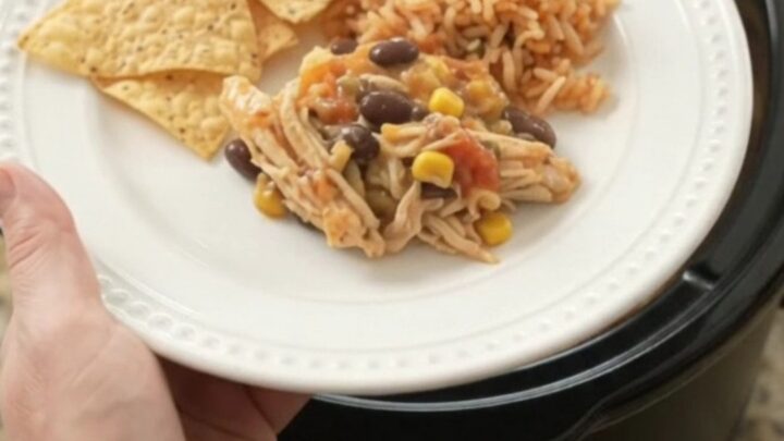 Crockpot full of creamy pepper jack chicken with black beans and corn