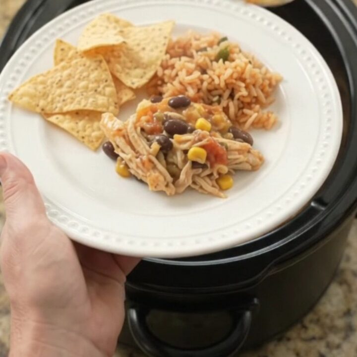 Crockpot full of creamy pepper jack chicken with black beans and corn