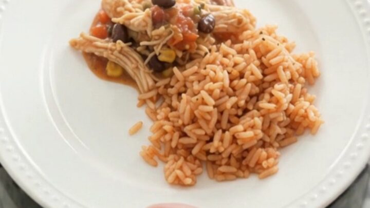 Slow cooker fiesta chicken with melted Oaxaca cheese and black beans