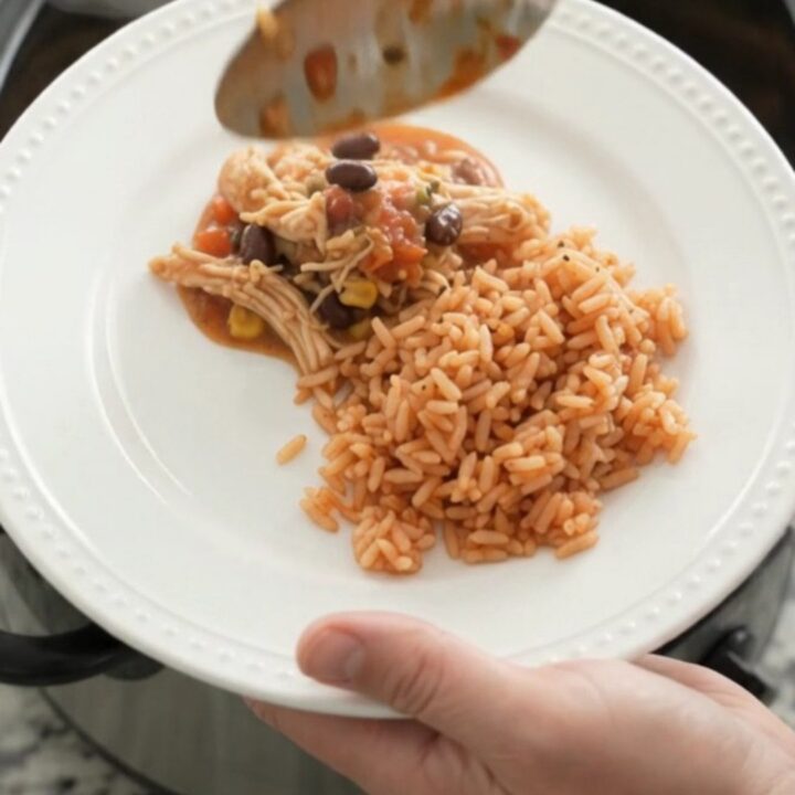 Slow cooker fiesta chicken with melted Oaxaca cheese and black beans