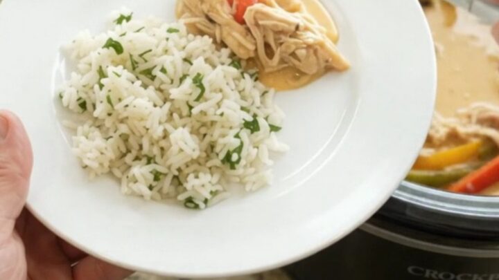 Shredded chicken and peppers in a creamy cheddar sauce in a slow cooker
