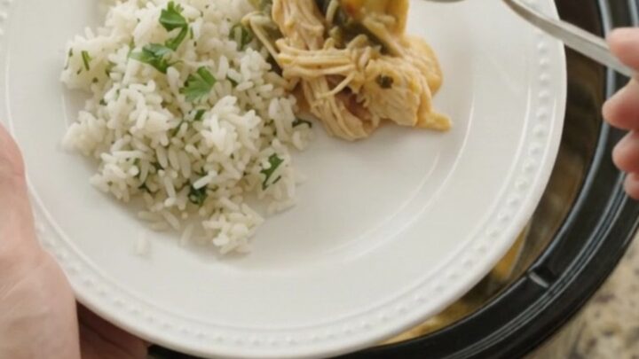 Shredded chicken, hominy, and roasted poblanos in a creamy cheese sauce in a slow cooker.