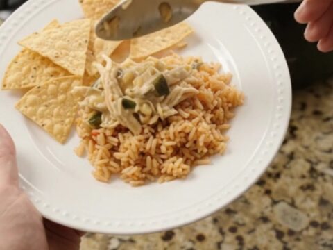 Slow cooker fiesta chicken with creamy pepper jack sauce, hominy, and poblano peppers