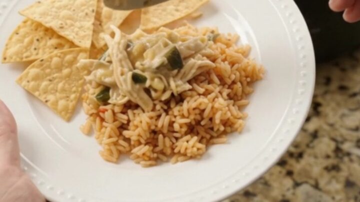 Slow cooker fiesta chicken with creamy pepper jack sauce, hominy, and poblano peppers