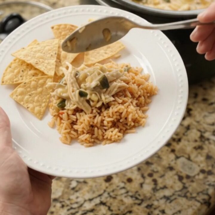 Slow cooker fiesta chicken with creamy pepper jack sauce, hominy, and poblano peppers