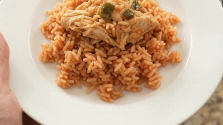 Shredded chipotle pineapple chicken with melted Oaxaca cheese in a slow cooker