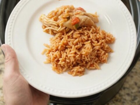 Shredded fiesta chicken with melted Oaxaca cheese in a slow cooker
