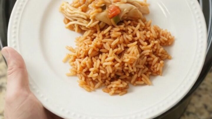 Shredded fiesta chicken with melted Oaxaca cheese in a slow cooker
