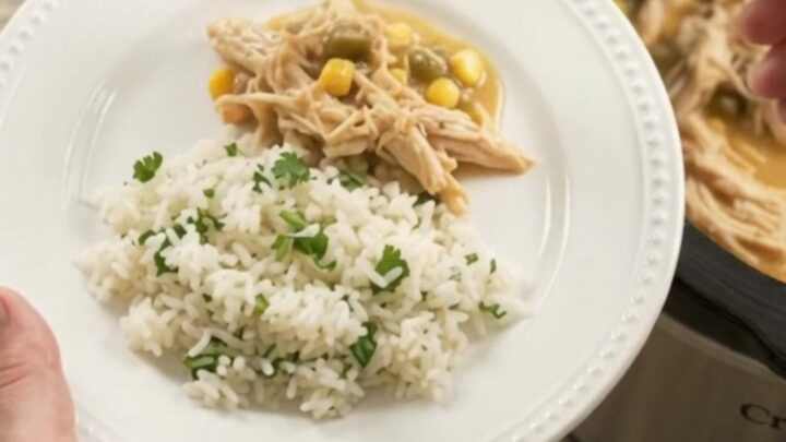 Creamy crockpot chicken with cheese and corn in a slow cooker
